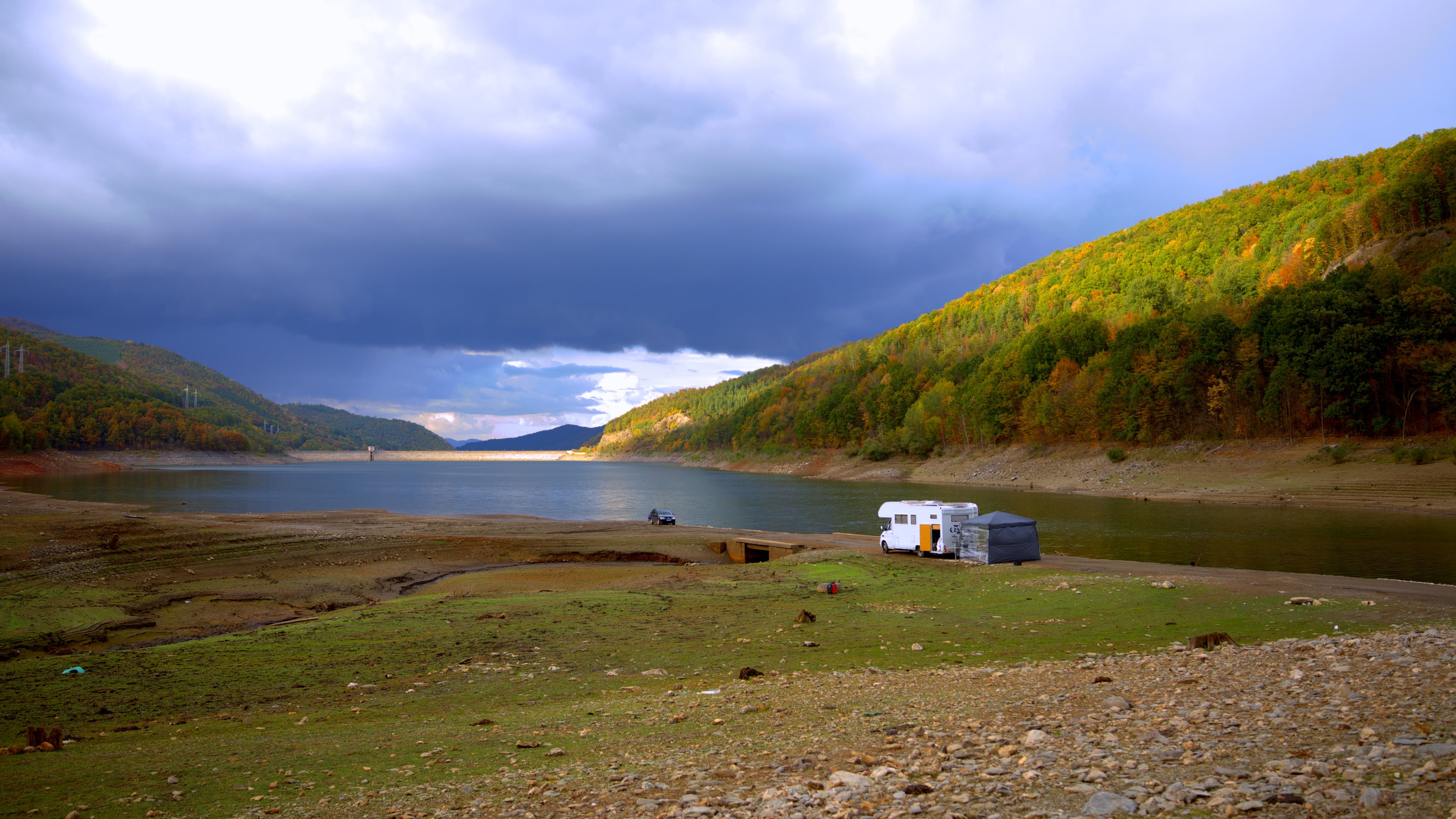 Fisherman and q camper at the Bebresh reservoir with Dam in the distance