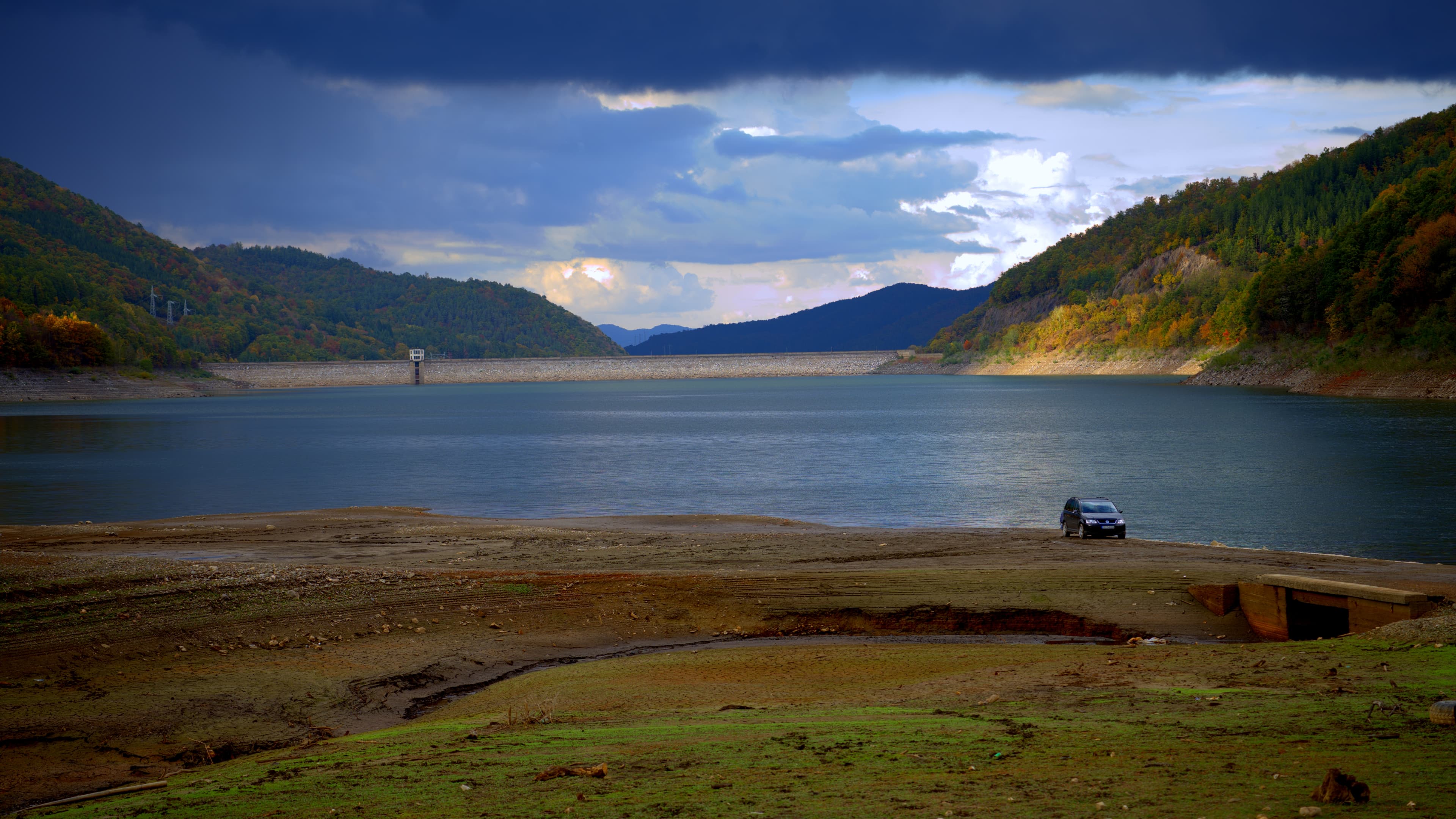 Fisherman at the Bebresh reservoir with Dam in the distance