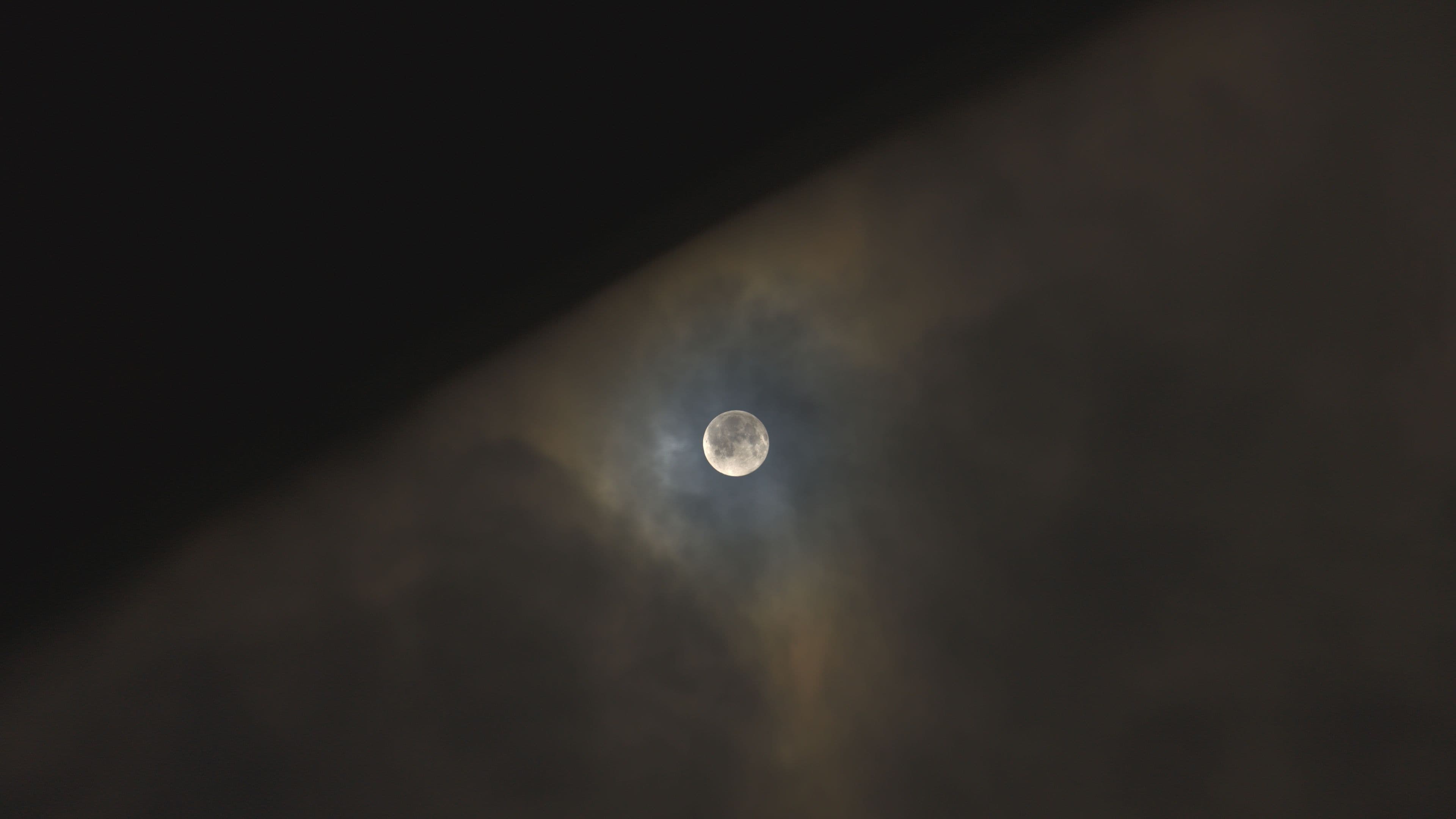 Moon in Skravena above the clouds