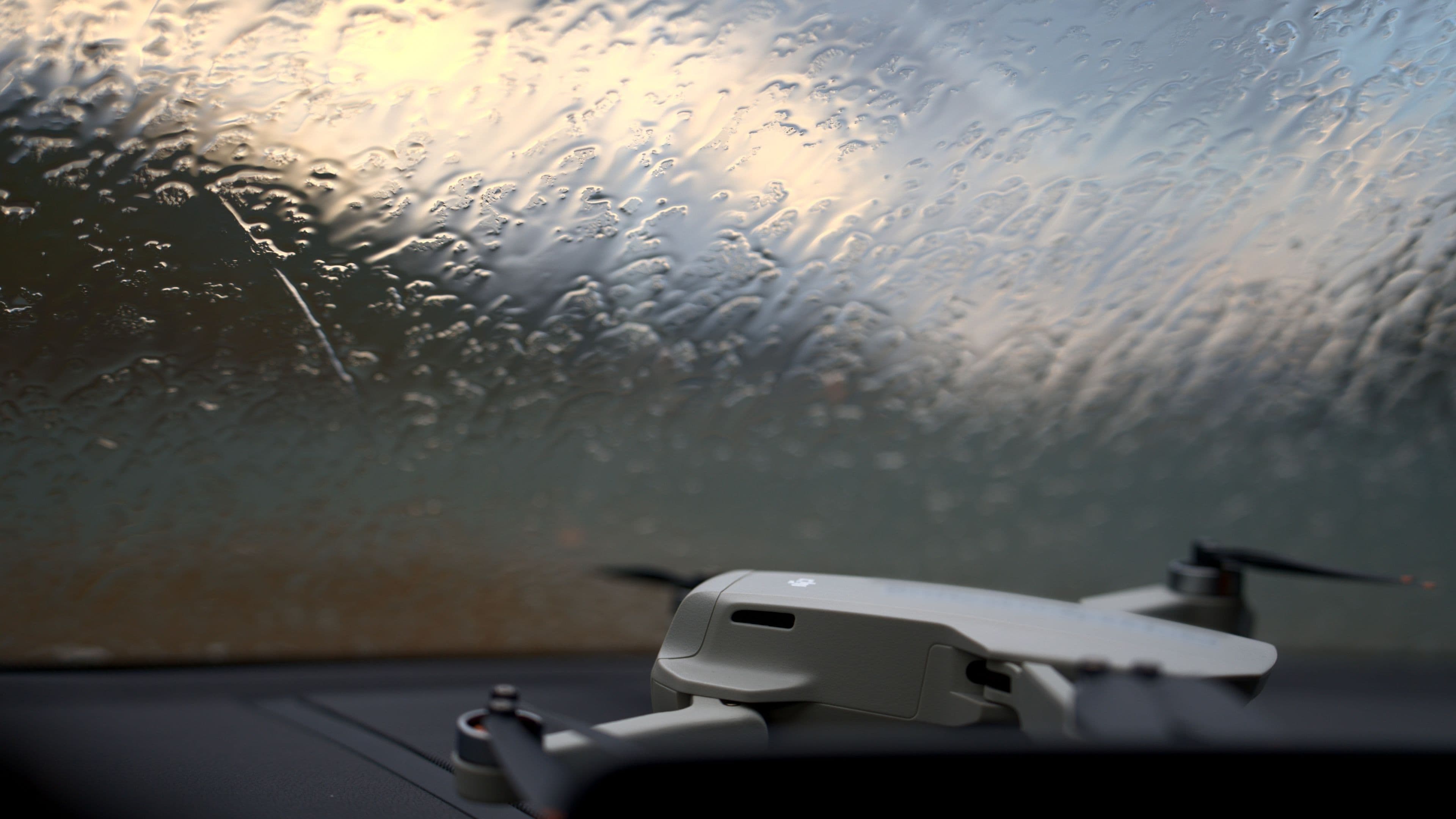 The drone is safely standing by behind the windshield during the storm